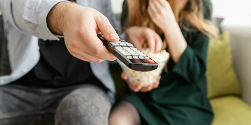 man holding remote control