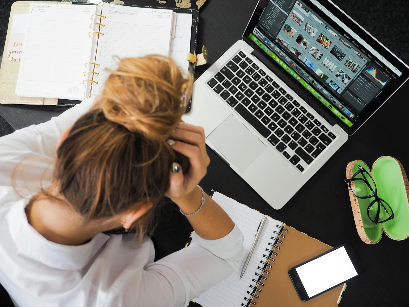 woman sitting in front of macbook