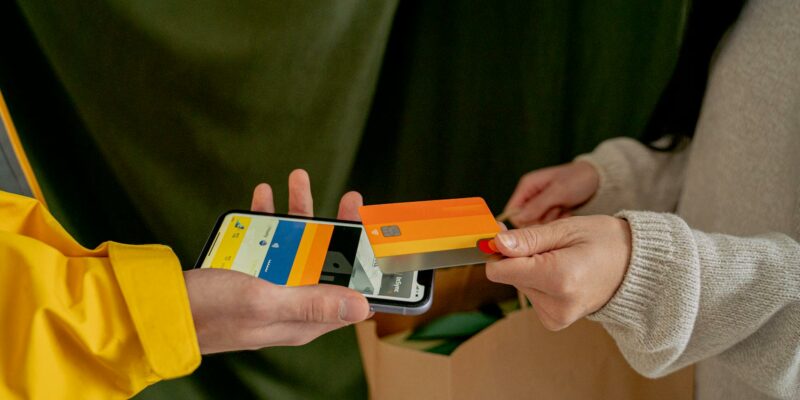 a woman paying with a credit card